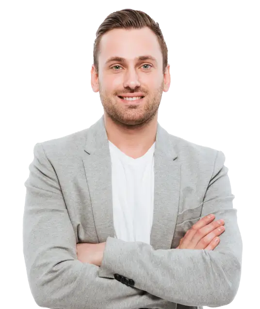 A man in a suit and tie stands confidently with his arms crossed, conveying a professional demeanor.